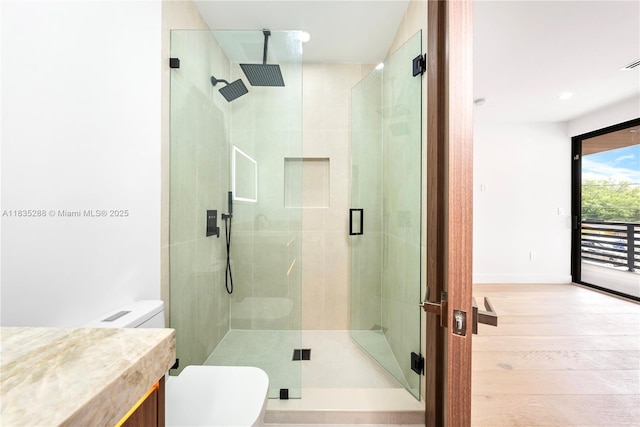 260 NW 47th St, Miami, FL 33127 - full bathroom with a stall shower, wood finished floors, and vanity