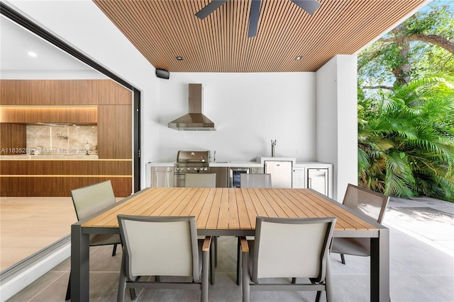 260 NW 47th St, Miami, FL 33127 - view of patio featuring outdoor dining area, exterior kitchen, and beverage cooler