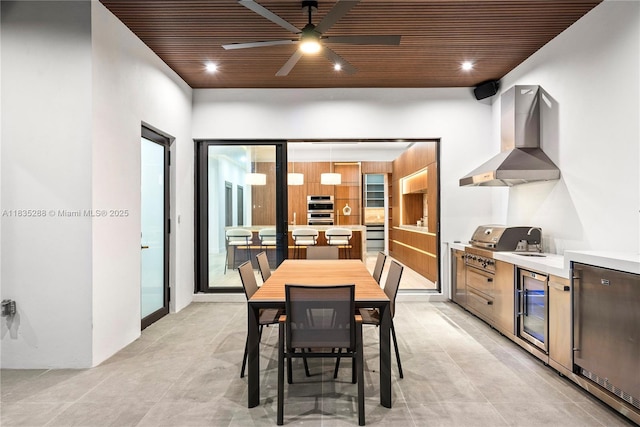 260 NW 47th St, Miami, FL 33127 - dining space featuring wine cooler, ceiling fan, and wood ceiling