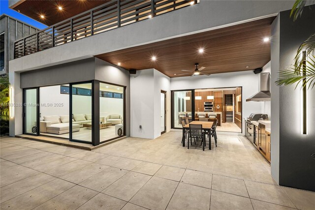 260 NW 47th St, Miami, FL 33127 - view of patio / terrace featuring an outdoor kitchen, outdoor dining space, and a ceiling fan