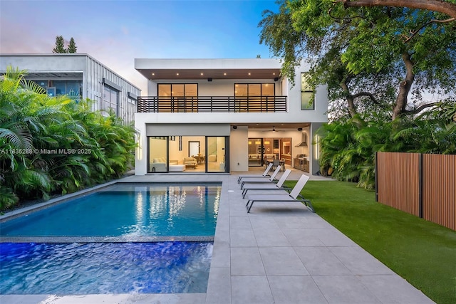 260 NW 47th St, Miami, FL 33127 - rear view of property with a balcony, a patio area, stucco siding, and ceiling fan