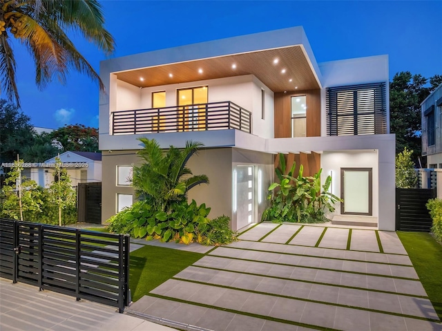 260 NW 47th St, Miami, FL 33127 - modern home with a balcony and stucco siding
