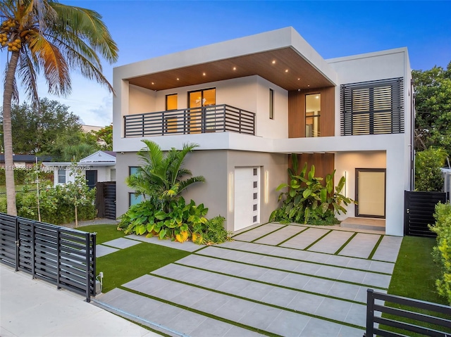 260 NW 47th St, Miami, FL 33127 - modern home with a balcony and stucco siding