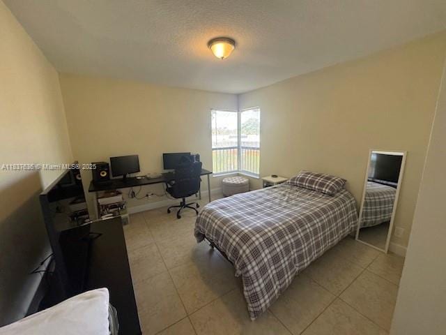 3817 Cocoplum Cir Unit 3585, Coconut Creek, FL 33063 - bedroom featuring a desk and light tile patterned floors