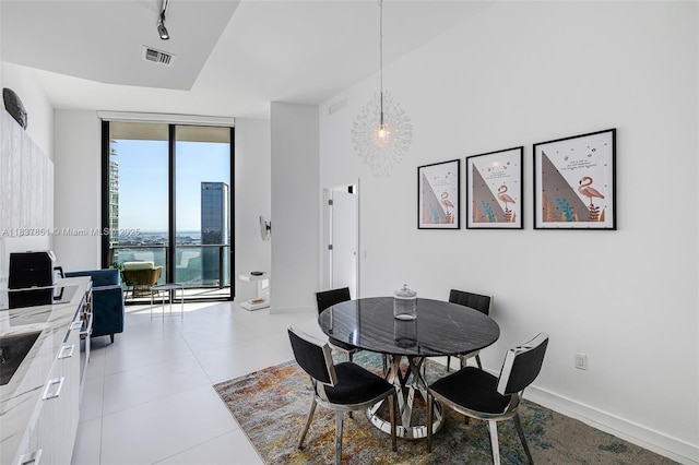 501 NE 31st St Unit 4007, Miami, FL 33137 - dining area featuring expansive windows and light tile patterned floors