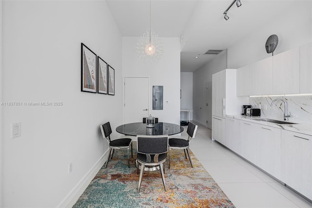 501 NE 31st St Unit 4007, Miami, FL 33137 - dining area with electric panel and light tile patterned flooring