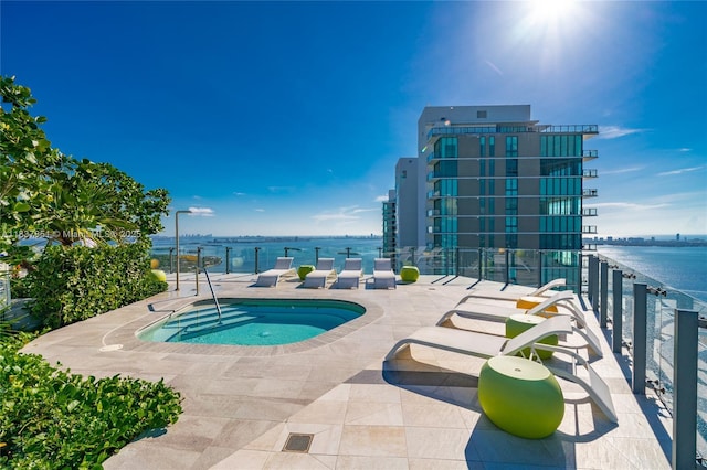501 NE 31st St Unit 4007, Miami, FL 33137 - view of swimming pool featuring a water view, a hot tub, and a patio area