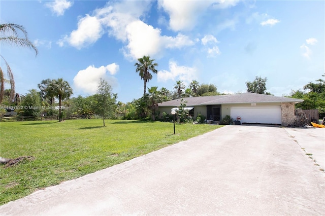 17041 Tarpon Way, Fort Myers, FL 33917 - view of front facade featuring a garage, concrete driveway, and a front yard