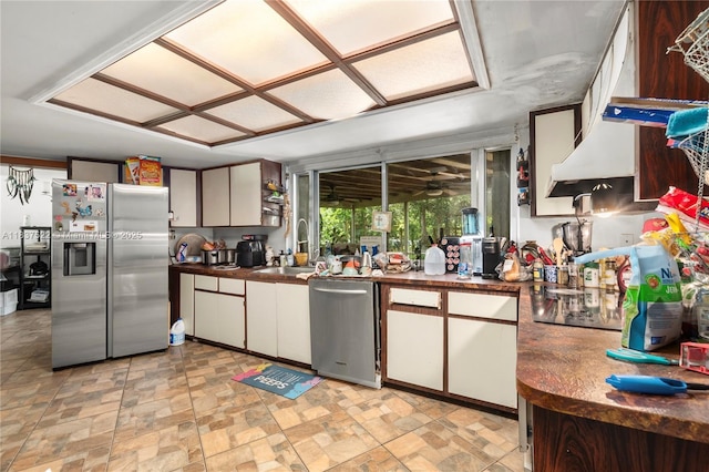 17041 Tarpon Way, Fort Myers, FL 33917 - kitchen with appliances with stainless steel finishes, dark countertops, light stone finish floors, and white cabinetry