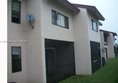 7921 Southgate Blvd Unit D5, North Lauderdale, FL 33068 - back of house with stucco siding
