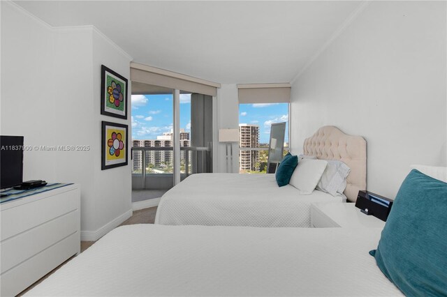 21055 Yacht Club Dr Unit 1504, Aventura, FL 33180 - bedroom featuring access to exterior, multiple windows, ornamental molding, and a view of city