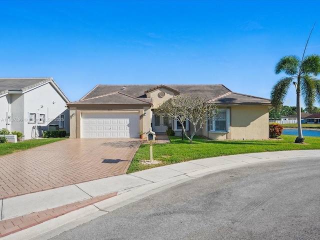 4024 Summer Chase Ct, Lake Worth, FL 33467 - ranch-style home with decorative driveway, stucco siding, an attached garage, and a front lawn