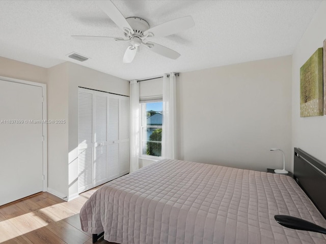 4024 Summer Chase Ct, Lake Worth, FL 33467 - bedroom with wood finished floors, a closet, ceiling fan, and a textured ceiling