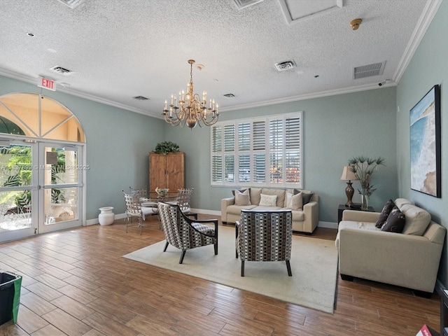 4024 Summer Chase Ct, Lake Worth, FL 33467 - living room with ornamental molding, wood finished floors, a chandelier, and a textured ceiling