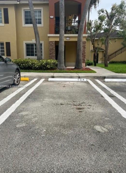 3395 NE 9th St Unit 104, Homestead, FL 33033 - view of uncovered parking lot