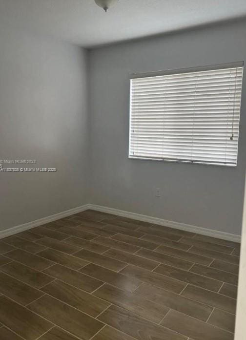 3395 NE 9th St Unit 104, Homestead, FL 33033 - unfurnished room featuring baseboards