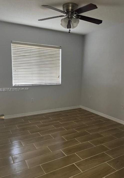 3395 NE 9th St Unit 104, Homestead, FL 33033 - spare room with a ceiling fan and baseboards