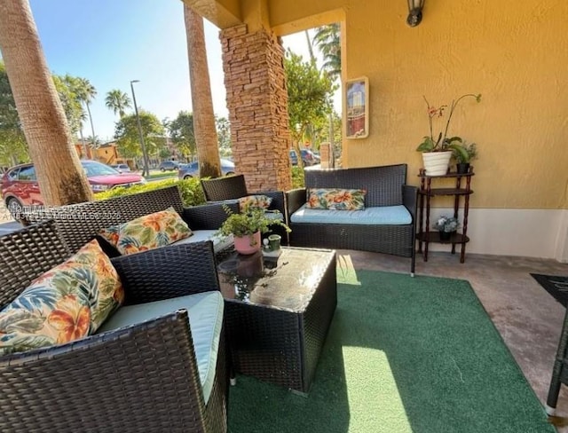 3395 NE 9th St Unit 104, Homestead, FL 33033 - view of patio / terrace featuring an outdoor hangout area