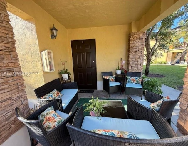 3395 NE 9th St Unit 104, Homestead, FL 33033 - view of patio with an outdoor hangout area