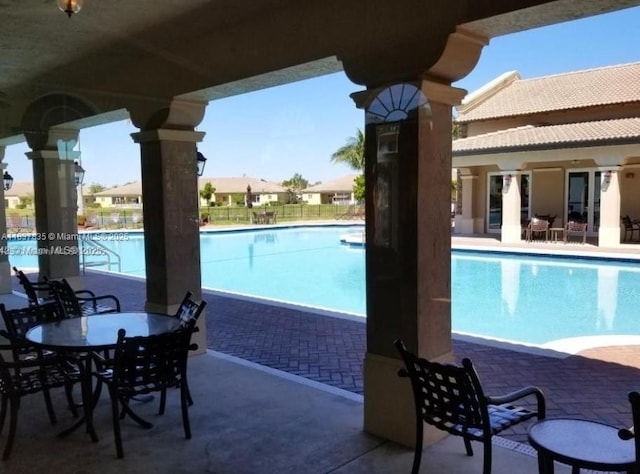 3395 NE 9th St Unit 104, Homestead, FL 33033 - community pool with a patio area