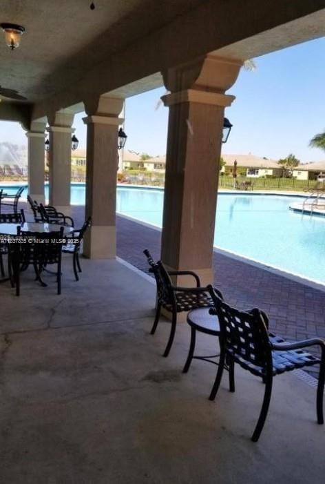 3395 NE 9th St Unit 104, Homestead, FL 33033 - view of patio / terrace featuring a community pool