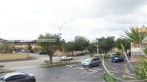 1305 W 46th St Unit 230, Hialeah, FL 33012 - view of asphalt street featuring street lights