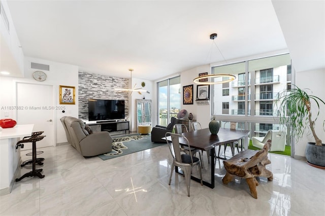 1010 SW 2nd Ave Unit Lph04, Miami, FL 33130 - dining room featuring light marble finish flooring and expansive windows