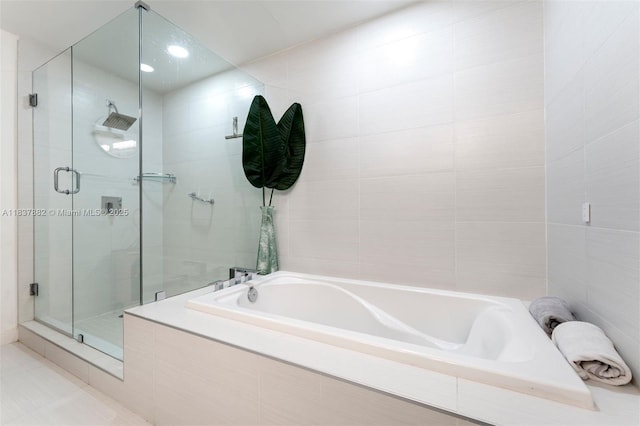 1010 SW 2nd Ave Unit Lph04, Miami, FL 33130 - full bathroom with a stall shower, a bath, and tile walls