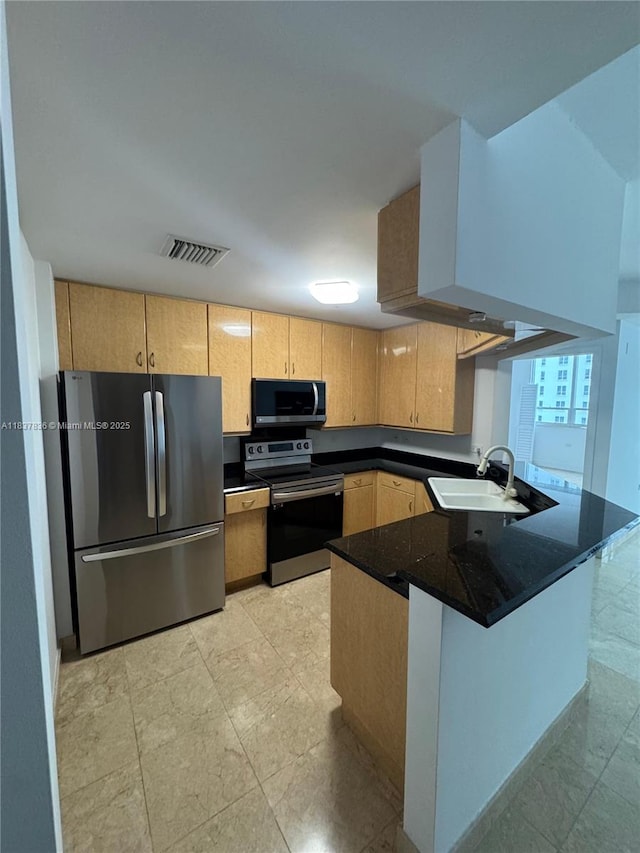 801 Brickell Key Blvd Unit 1005, Miami, FL 33131 - kitchen with appliances with stainless steel finishes, a peninsula, and light brown cabinetry