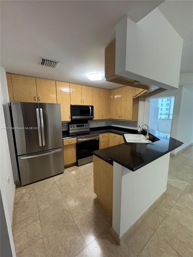 801 Brickell Key Blvd Unit 1005, Miami, FL 33131 - kitchen featuring appliances with stainless steel finishes, a peninsula, and dark countertops