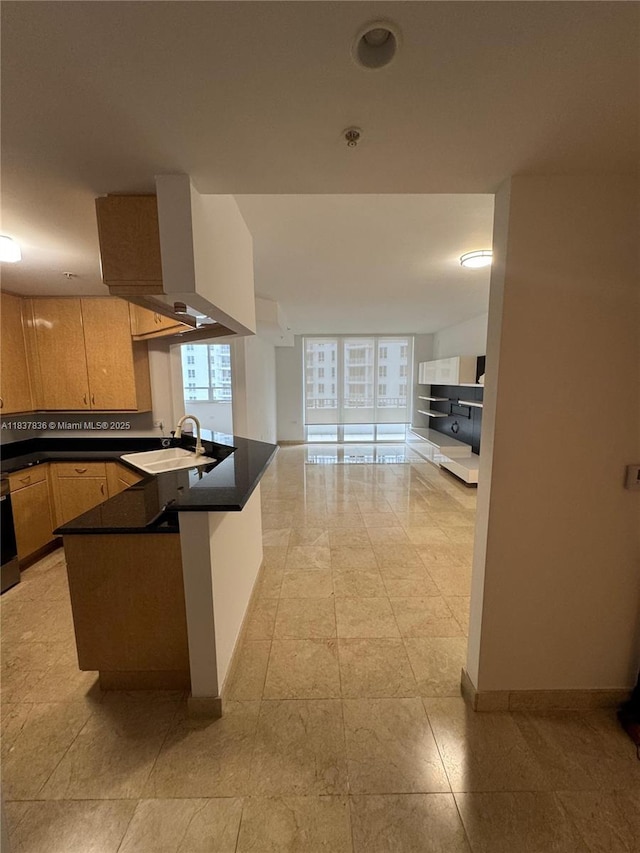 801 Brickell Key Blvd Unit 1005, Miami, FL 33131 - kitchen featuring dark countertops, a peninsula, decorative backsplash, open floor plan, and wall oven