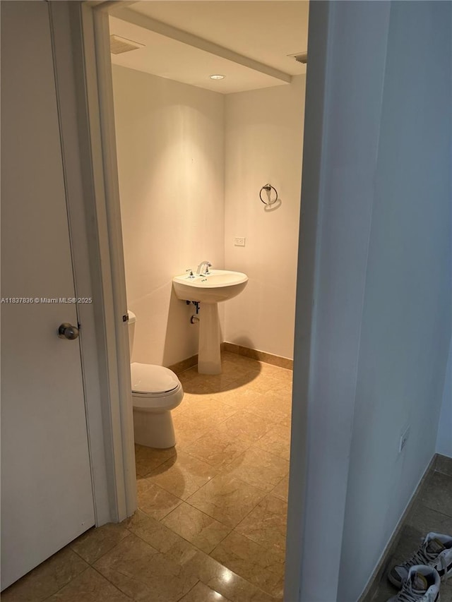 801 Brickell Key Blvd Unit 1005, Miami, FL 33131 - bathroom with toilet and baseboards