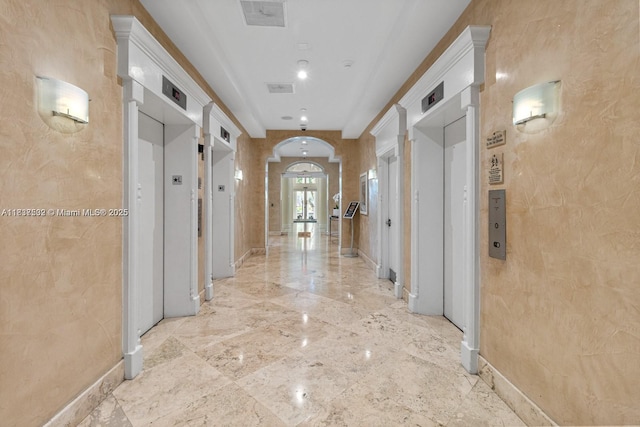 770 Claughton Island Dr Unit Ph21, Miami, FL 33131 - corridor featuring arched walkways and elevator