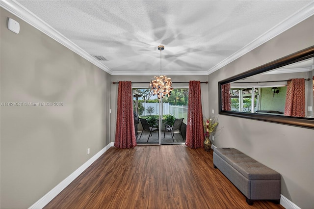 18205 NW 21st St, Pembroke Pines, FL 33029 - unfurnished dining area with a chandelier, wood finished floors, ornamental molding, and a textured ceiling