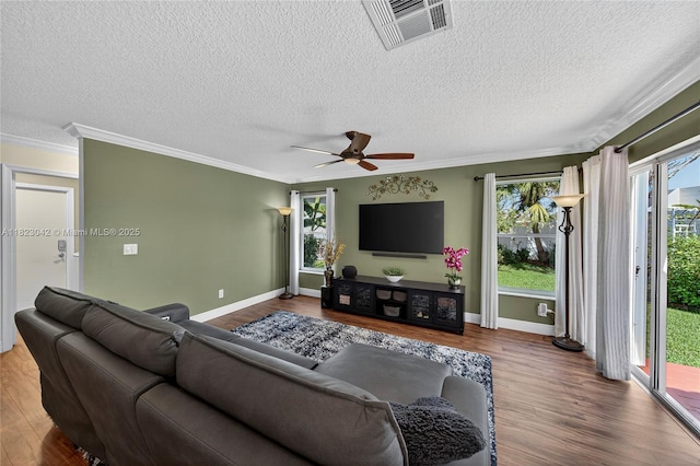 18205 NW 21st St, Pembroke Pines, FL 33029 - living room featuring wood finished floors, ornamental molding, plenty of natural light, ceiling fan, and a textured ceiling