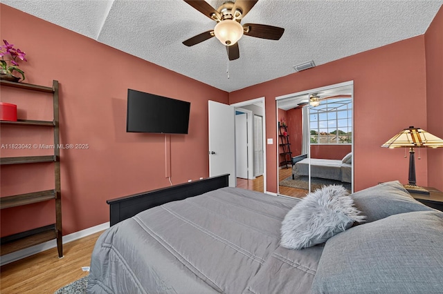18205 NW 21st St, Pembroke Pines, FL 33029 - bedroom featuring wood finished floors, a textured ceiling, and ceiling fan