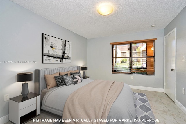 15560 SW 104th Ter Unit 611, Miami, FL 33196 - bedroom featuring a textured ceiling and baseboards