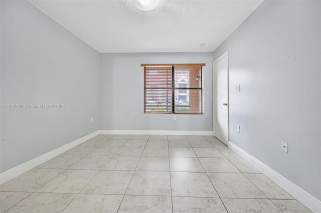 15560 SW 104th Ter Unit 611, Miami, FL 33196 - unfurnished room with marble finish flooring and a textured ceiling