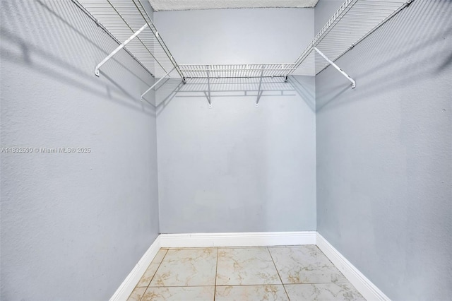 15560 SW 104th Ter Unit 611, Miami, FL 33196 - walk in closet featuring marble finish flooring