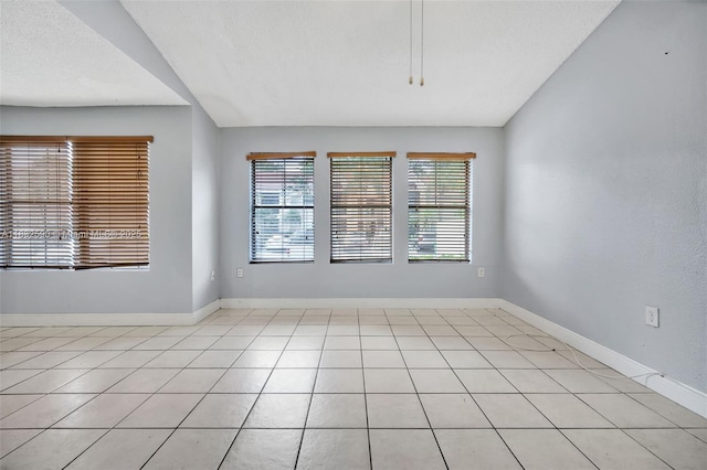 15560 SW 104th Ter Unit 611, Miami, FL 33196 - spare room with baseboards and light tile patterned flooring