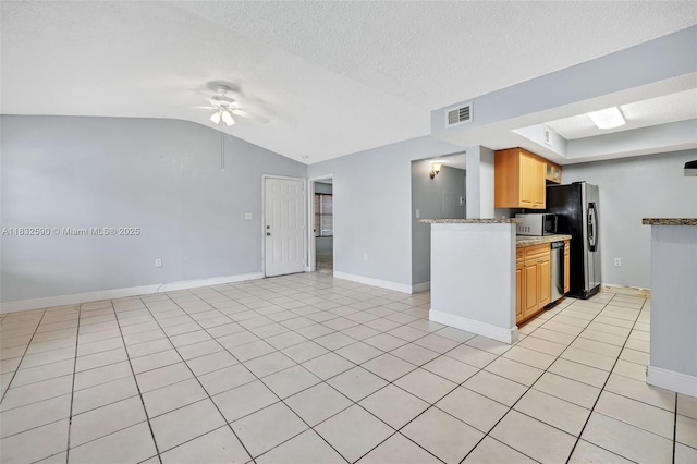 15560 SW 104th Ter Unit 611, Miami, FL 33196 - kitchen featuring appliances with stainless steel finishes, ceiling fan, lofted ceiling, open floor plan, and a textured ceiling