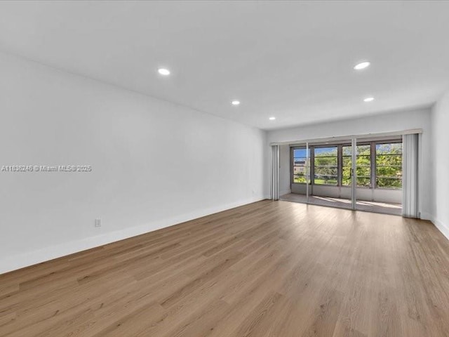 6000 NW 64th Ave Unit 303, Tamarac, FL 33319 - unfurnished room featuring recessed lighting and wood finished floors