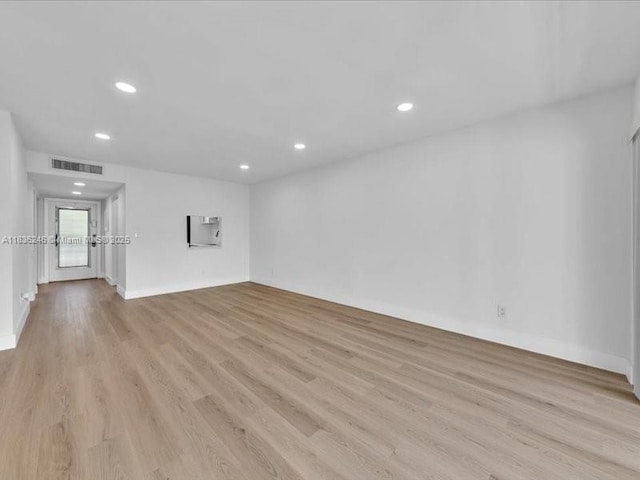 6000 NW 64th Ave Unit 303, Tamarac, FL 33319 - spare room featuring light wood finished floors and recessed lighting