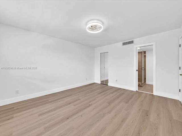 6000 NW 64th Ave Unit 303, Tamarac, FL 33319 - unfurnished bedroom with light wood-style flooring and a closet