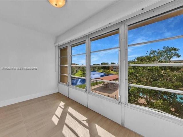 6000 NW 64th Ave Unit 303, Tamarac, FL 33319 - empty room with a water view and baseboards
