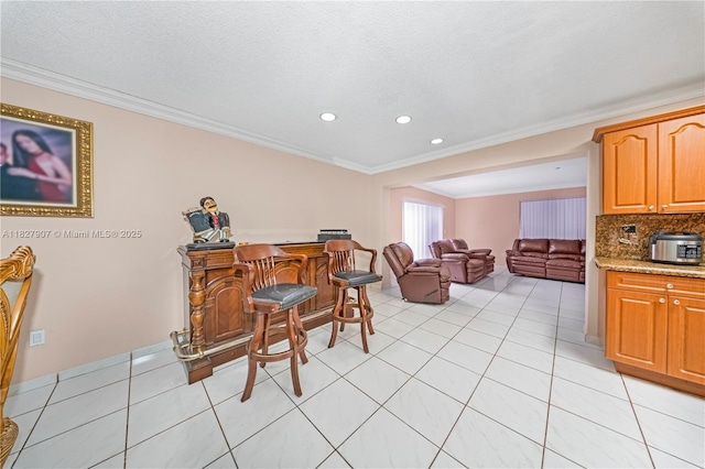 3631 SW 127th Ave, Miami, FL 33175 - dining space featuring crown molding, a dry bar, recessed lighting, and light tile patterned floors