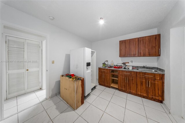 3631 SW 127th Ave, Miami, FL 33175 - kitchen featuring brown cabinets and light tile patterned floors
