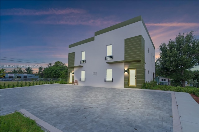 11128NW 17th Ave Unit 1-2, Miami, FL 33167 - view of home's exterior with stucco siding