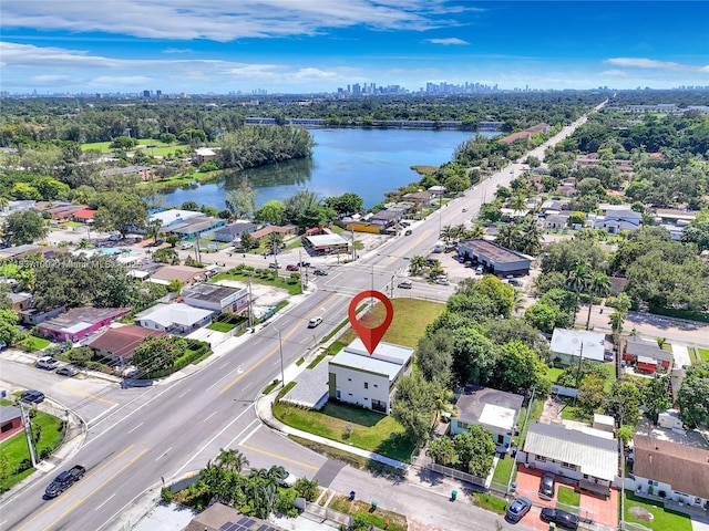 11128NW 17th Ave Unit 1-2, Miami, FL 33167 - aerial perspective of suburban area with a large body of water and skyline