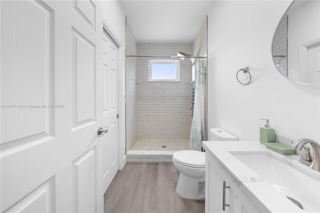 11128NW 17th Ave Unit 1-2, Miami, FL 33167 - bathroom with a tile shower, vanity, and wood finished floors